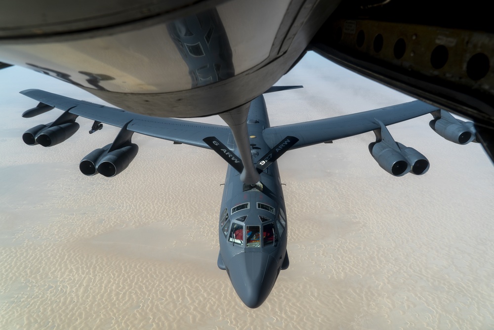 B-52 Stratofortress and F-16 Fighting Falcon fly over U.S. Central Command