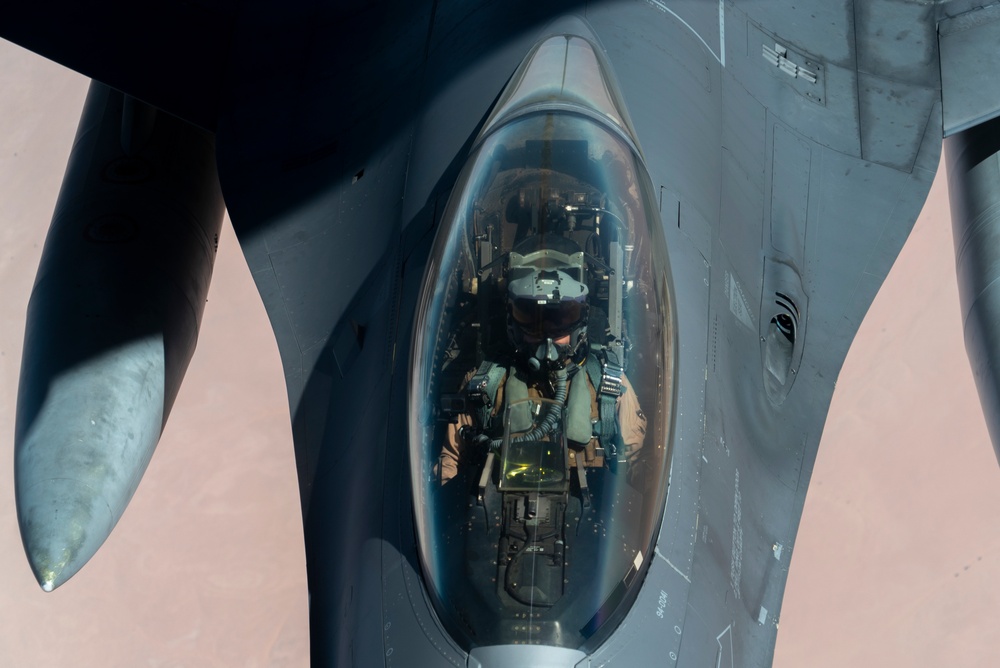 B-52 Stratofortress and F-16 Fighting Falcon fly over U.S. Central Command