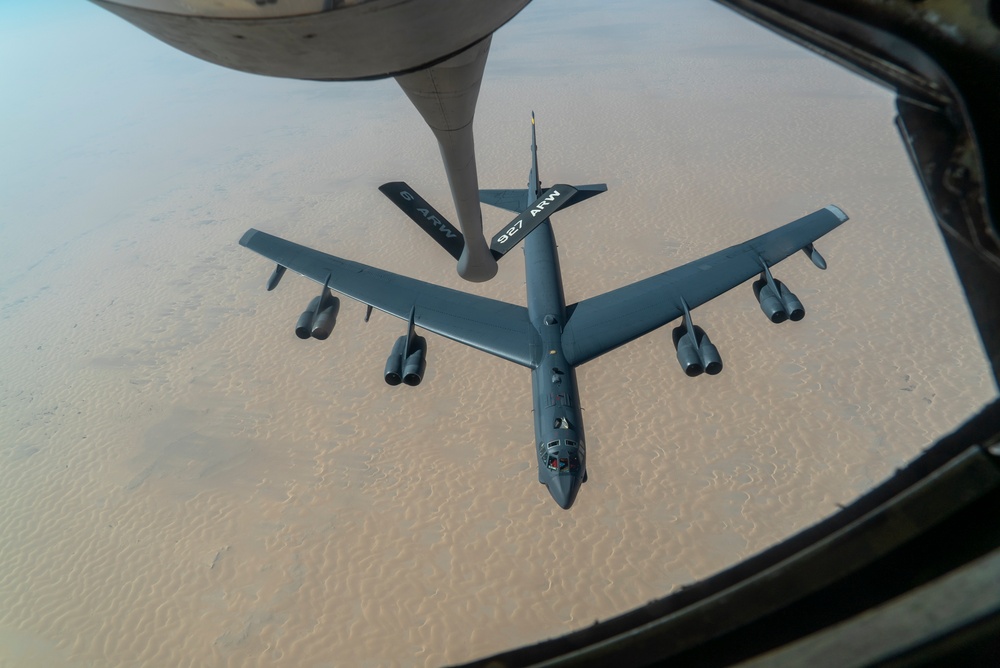 B-52 Stratofortress and F-16 Fighting Falcon fly over U.S. Central Command