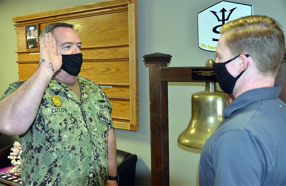 Son Receives Oath of Enlistment from Father