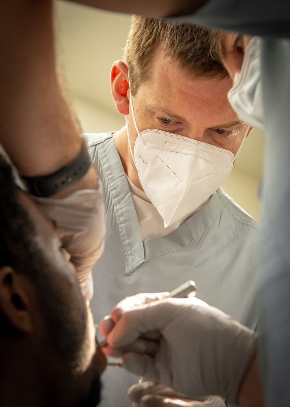NMCSD OMFS Inspects Patient’s Oral Cavity After Immediate Jaw Replacement Procedure