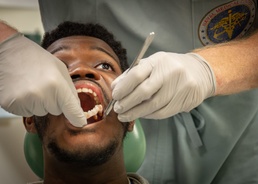 NMCSD OMFS Inspects Patient’s Oral Cavity After Immediate Jaw Replacement Procedure