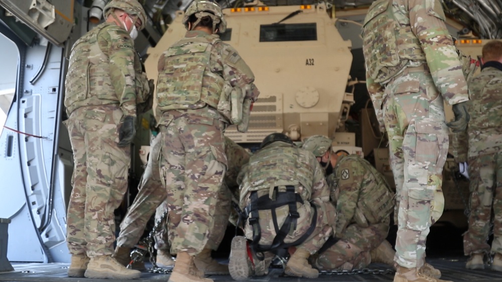 Soldiers Secure HIMARS onto C-17 aircraft