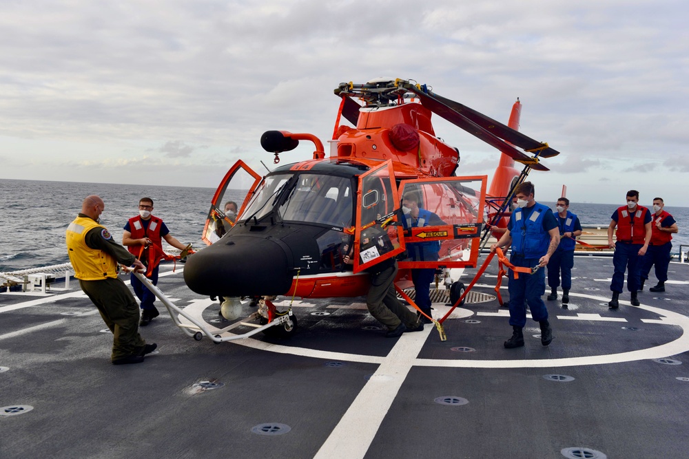 USCGC Stone crew traverses the MH-65 Dolphin