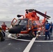 USCGC Stone crew traverses the MH-65 Dolphin