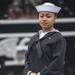 Seaman Jordan Sharp poses for a photo in front of USS Constitution