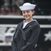 Airman Melanie Santos poses for a photo in front of USS Constitution
