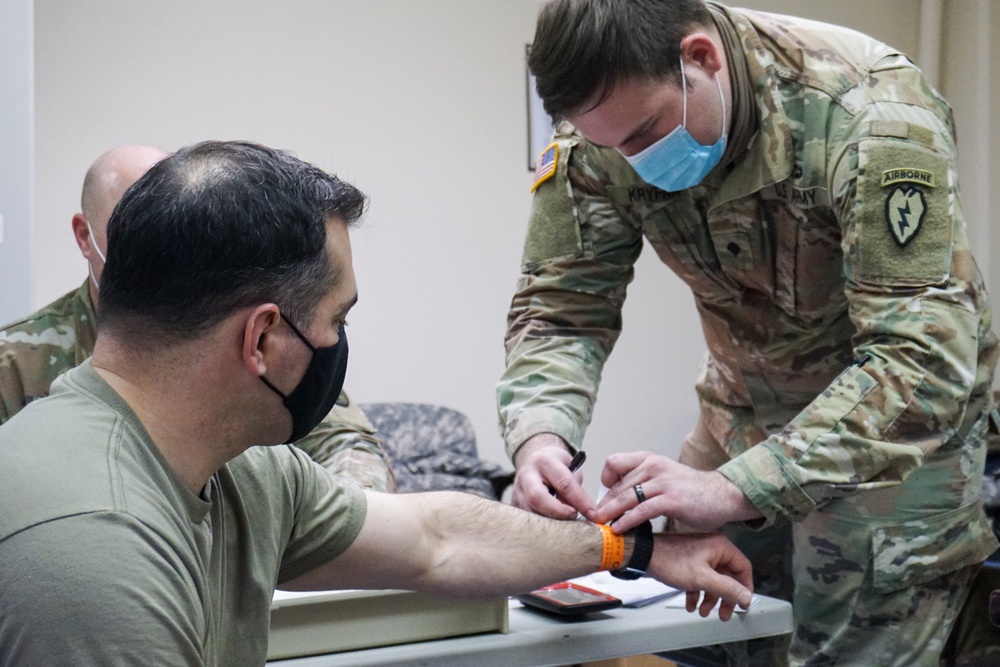 Spartan Medics Distribute Vaccine to Paratroopers