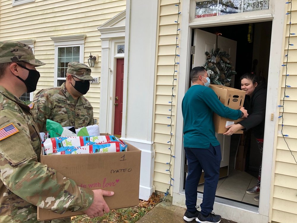 Soldiers within the DCS G6 and CIO delivering meals and gifts to local soldiers in need