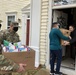 Soldiers within the DCS G6 and CIO delivering meals and gifts to local soldiers in need