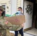 Soldiers within the DCS G6 and CIO delivering meals and gifts to local soldiers in need