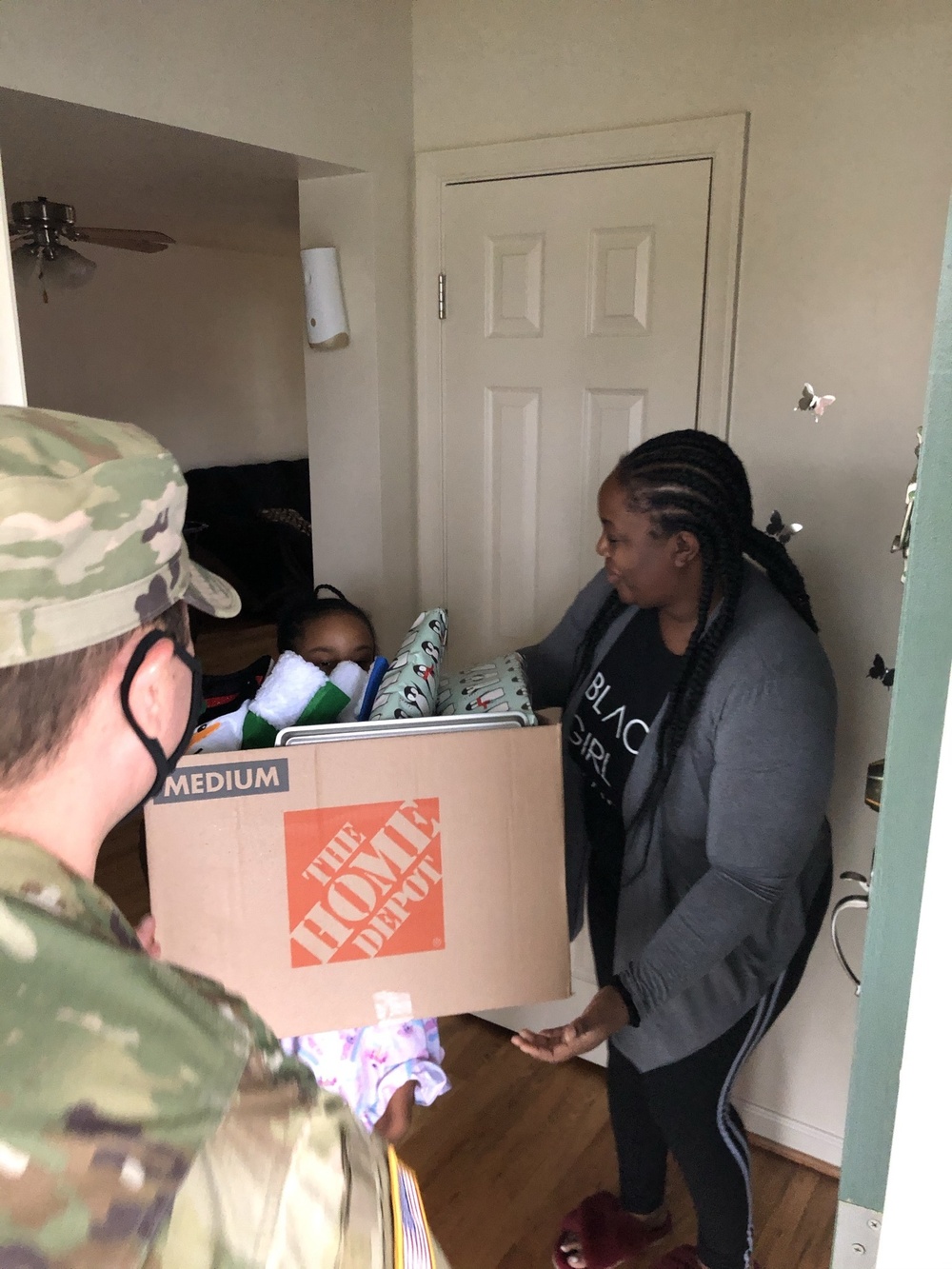 Soldiers within the DCS G6 and CIO delivering meals and gifts to local soldiers in need