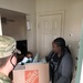 Soldiers within the DCS G6 and CIO delivering meals and gifts to local soldiers in need