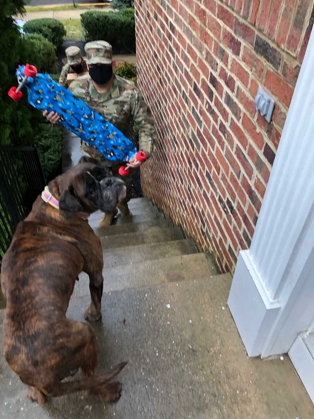 Soldiers within the DCS G6 and CIO delivering meals and gifts to local soldiers in need