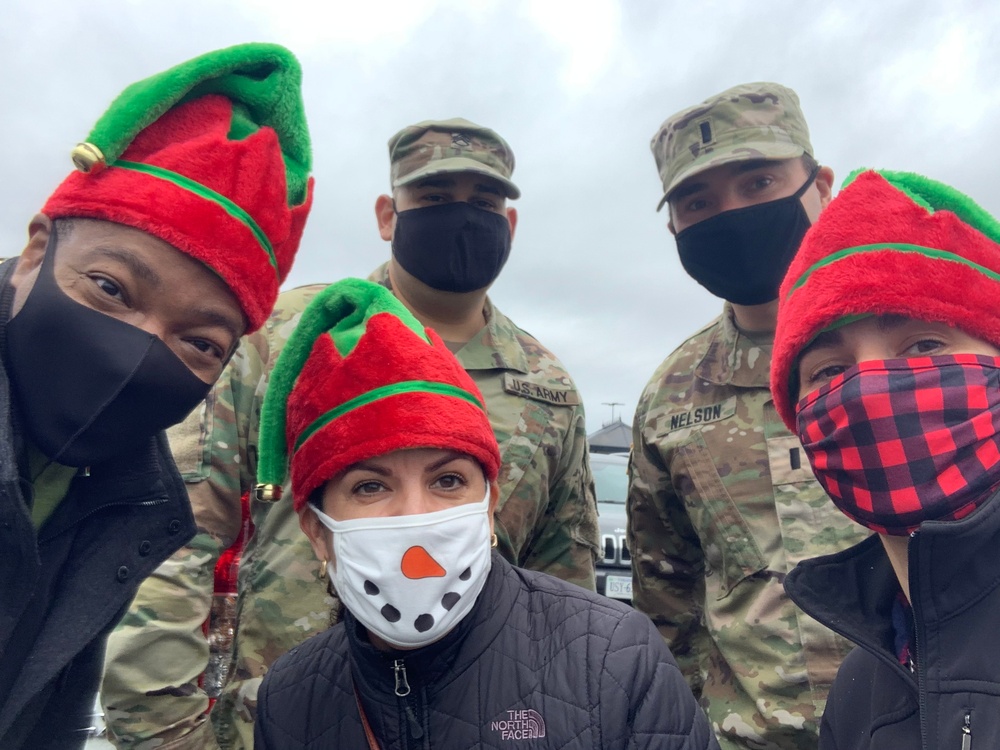 Soldiers within the DCS G6 and CIO delivering meals and gifts to local soldiers in need