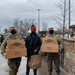 Soldiers within the DCS G6 and CIO delivering meals and gifts to local soldiers in need