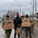 Soldiers within the DCS G6 and CIO delivering meals and gifts to local soldiers in need