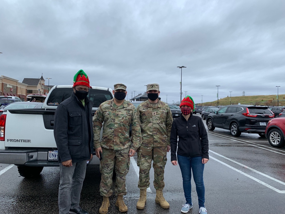Soldiers within the DCS G6 and CIO delivering meals and gifts to local soldiers in need