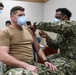 Lt. Eric Wright, an emergency medicine nurse assigned to U.S. Naval Hospital (USNH) Naples, receives the Moderna coronavirus (COVID-19) vaccine