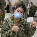 Lt. Cmdr. Kelly Peng, an emergency medicine physician assigned to U.S. Naval Hospital (USNH) Naples, is all smiles after completing the Moderna coronavirus (COVID-19) vaccine observation period
