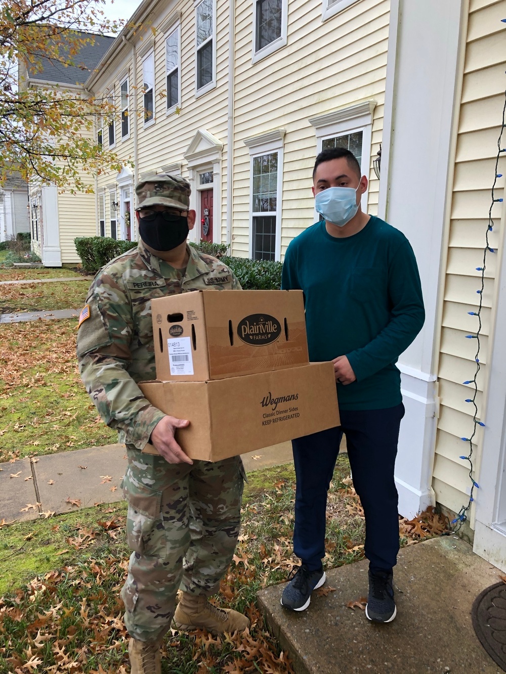 Soldiers within the DCS G6 and CIO delivering meals and gifts to local soldiers in need