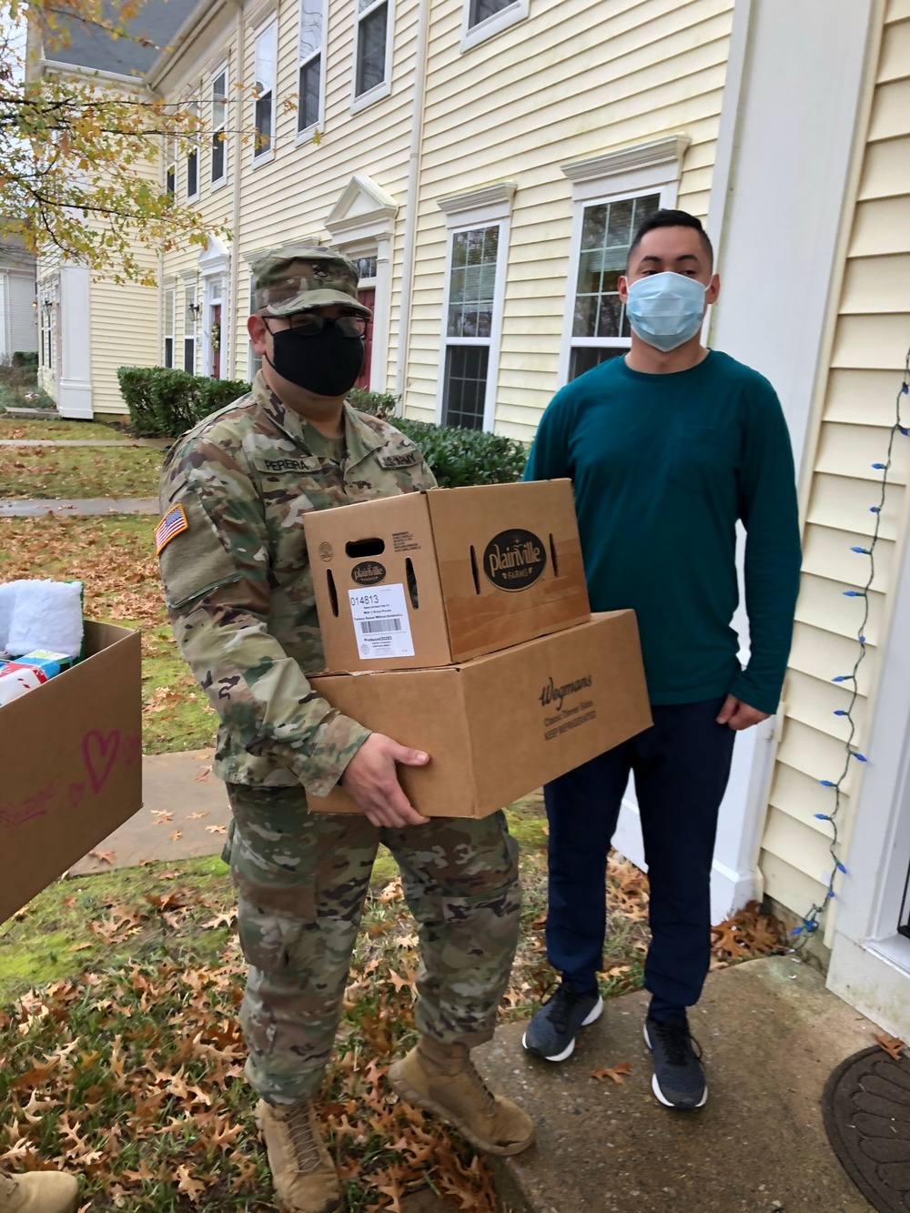 Soldiers within the DCS G6 and CIO delivering meals and gifts to local soldiers in need
