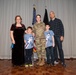 Chief Master Sergeant April Brittain poses with family after transfer ceremony into USSF