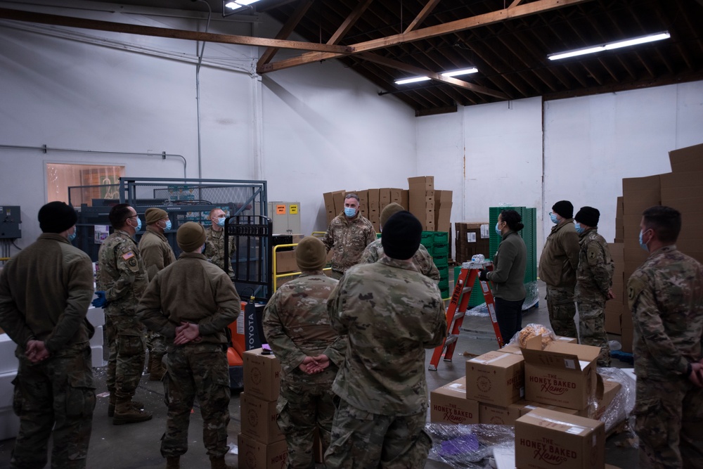 Guardsmen volunteer at local food bank