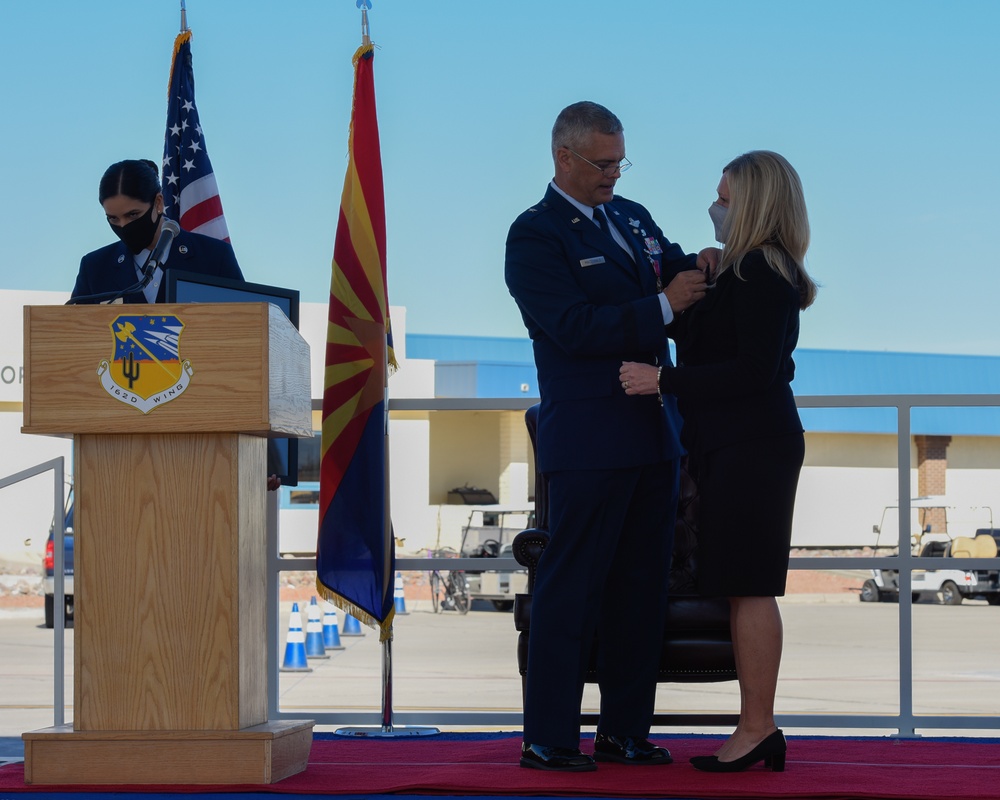 Brig. Gen. Andrew MacDonald, the former commander of the 162nd Wing, honors wife's service during retirement