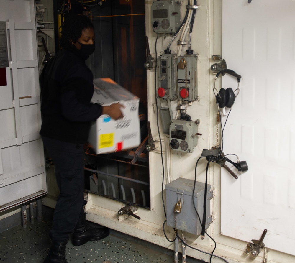 Sailor unloads supplies