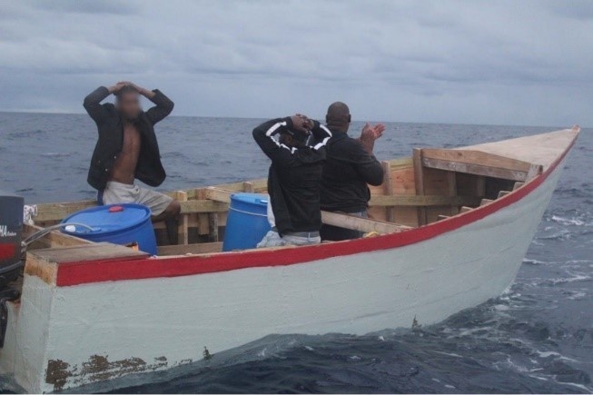 Coast Guard transfers custody of wanted fugitive to U.S. Marshals agents in Puerto Rico, following interdiction of makeshift boat in the Mona Passage