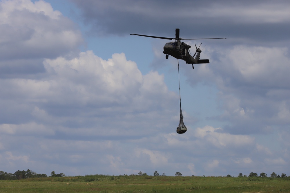 101st Airborne Division helicopter with supplies attached in net during JRTC rotation