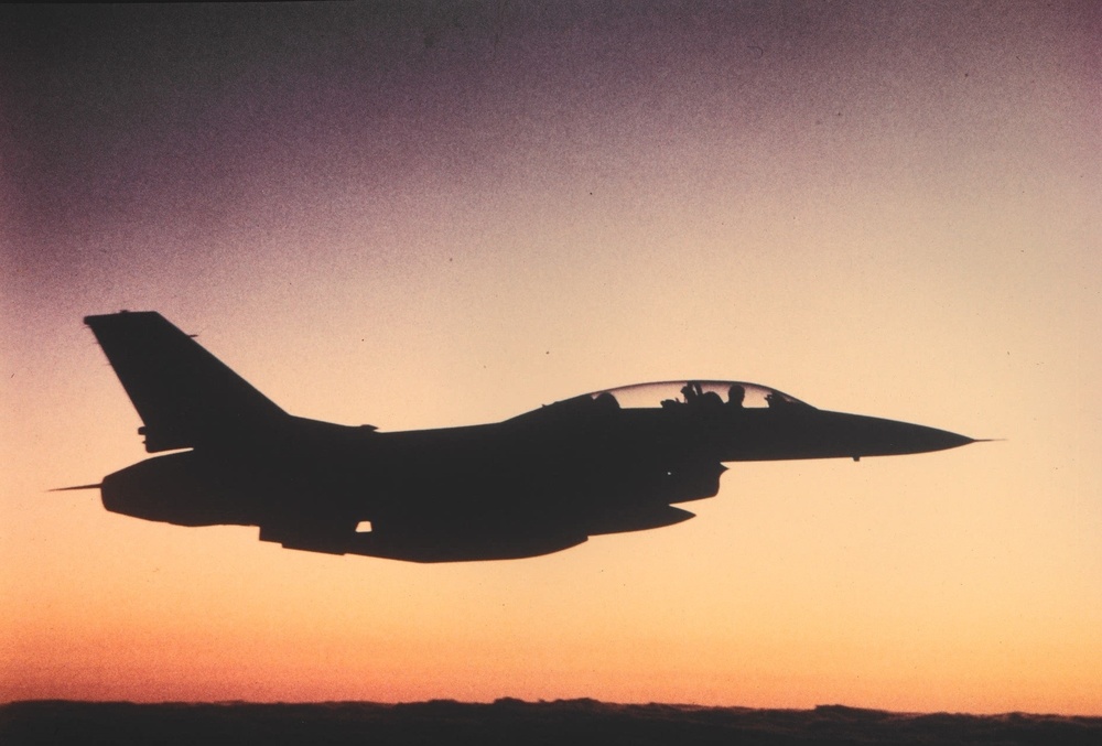 Historical photo of Air Force fighter jet in evening sky at JRTC.
