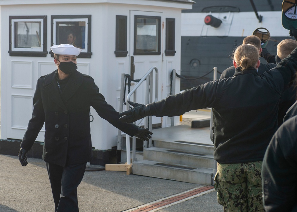 Seaman Jaida William, assigned to USS Constitution, bids farewell to the officers and crew of Constitution