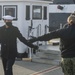Seaman Jaida William, assigned to USS Constitution, bids farewell to the officers and crew of Constitution