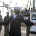 Aviation Electronics Technician Chelsea Melgar, assigned to USS Constitution, bids farewell to the officers and crew of Constitution
