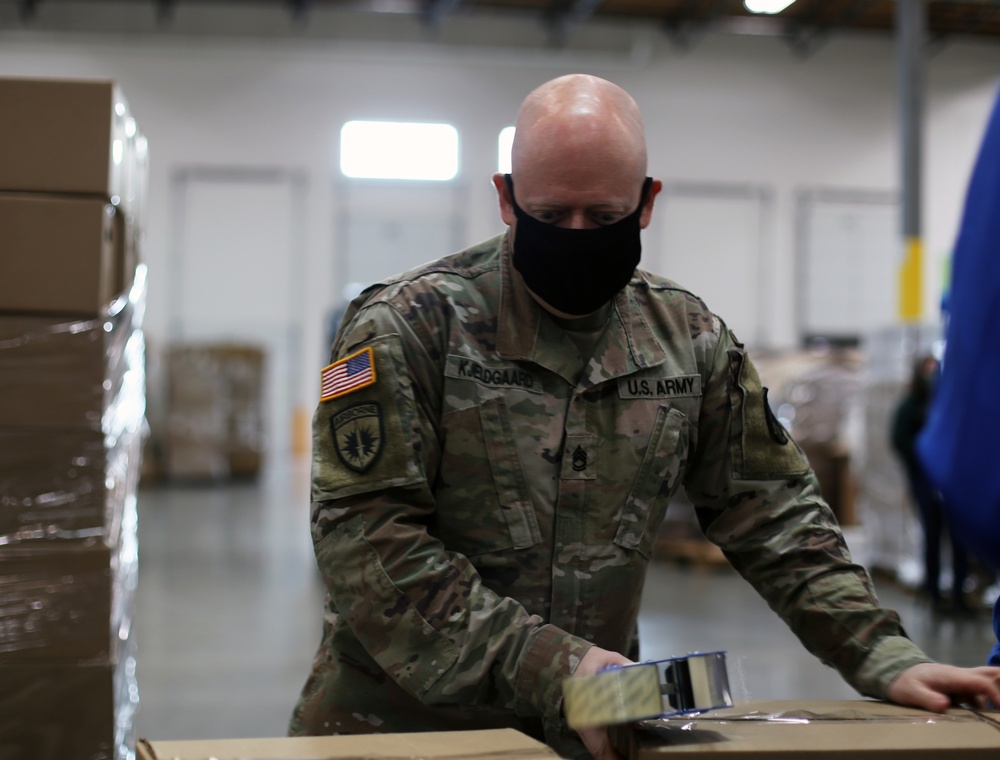 Washington National Guard supports Emergency Food Network pack emergency food boxes