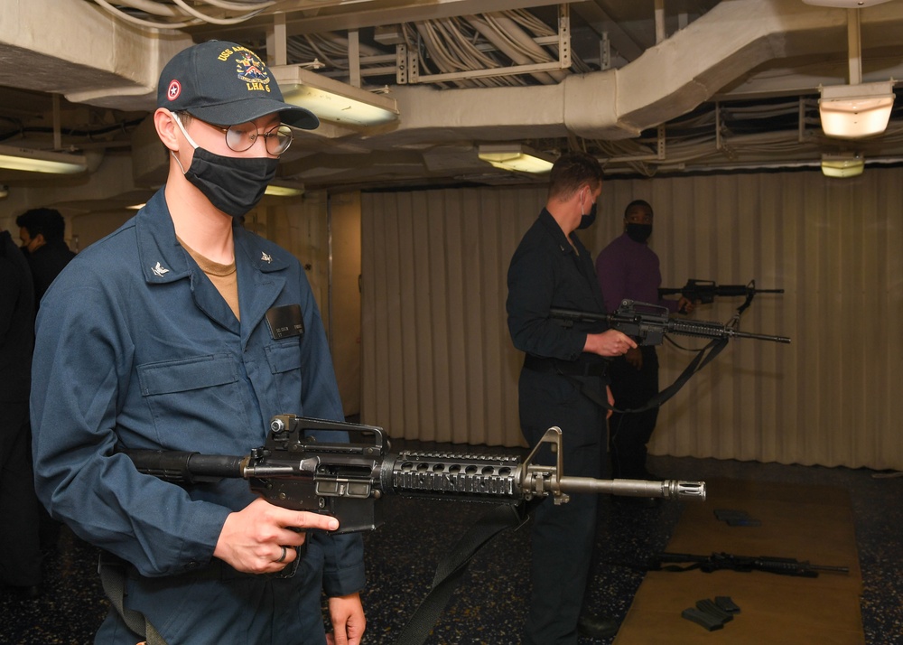 Sailors practice proper handling of an M4 service rifle