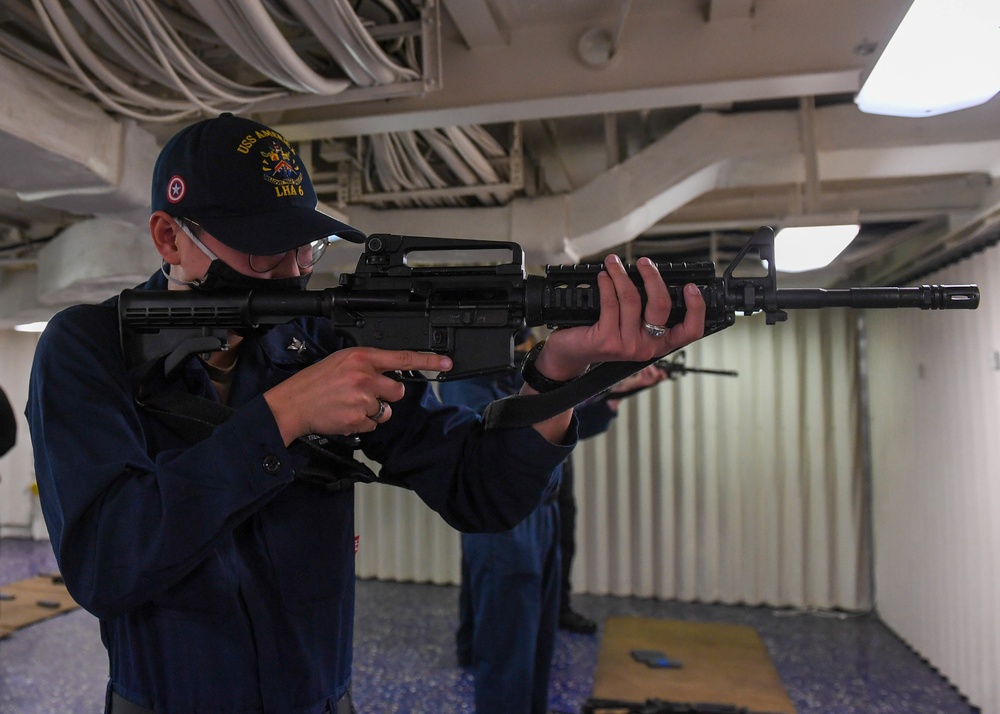 Sailor practices proper handling of an M4 service rifle