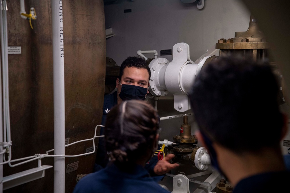 Sailors aboard USS America participate in a simulated casualty.