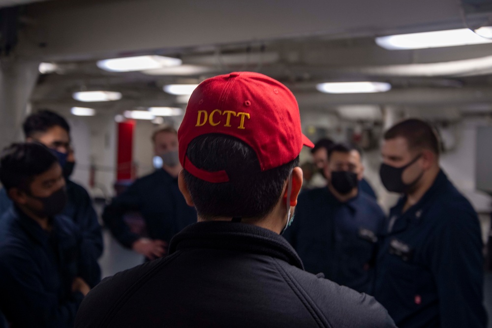 Sailors aboard USS America participate in a simulated casualty.