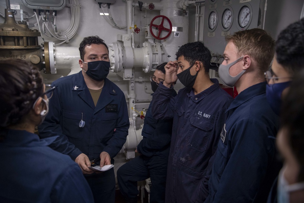 Sailors aboard USS America participate in a simulated casualty.