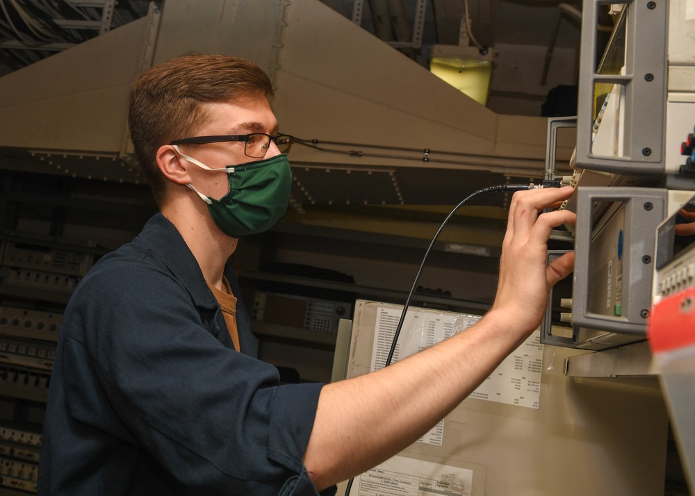 Sailor conducts maintenance