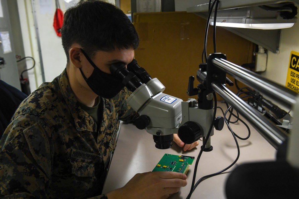 Sailor conducts maintenance