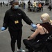 Staff workers at the Javits NY vaccination site receive the vaccine