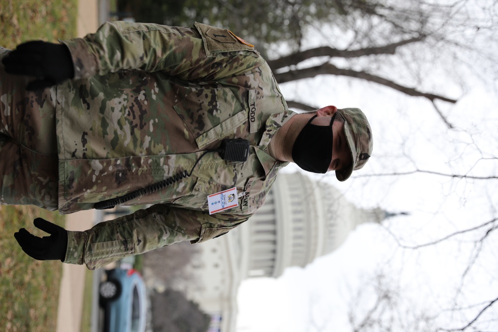 A Soldier from the 114th Infantry stands guard near the Capitol.