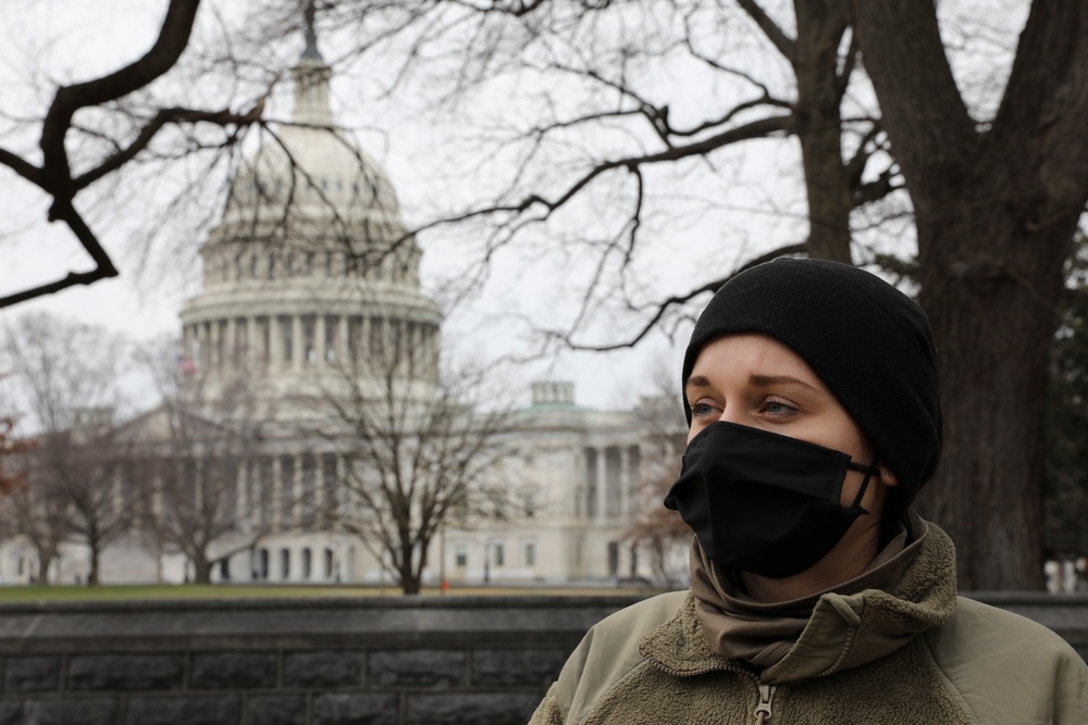 A Soldier with the 508th Military Police Company stands near the Capitol.