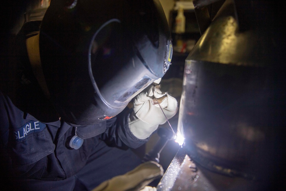 USS America (LHA 6) Sailor Repairs Spill Eqipment