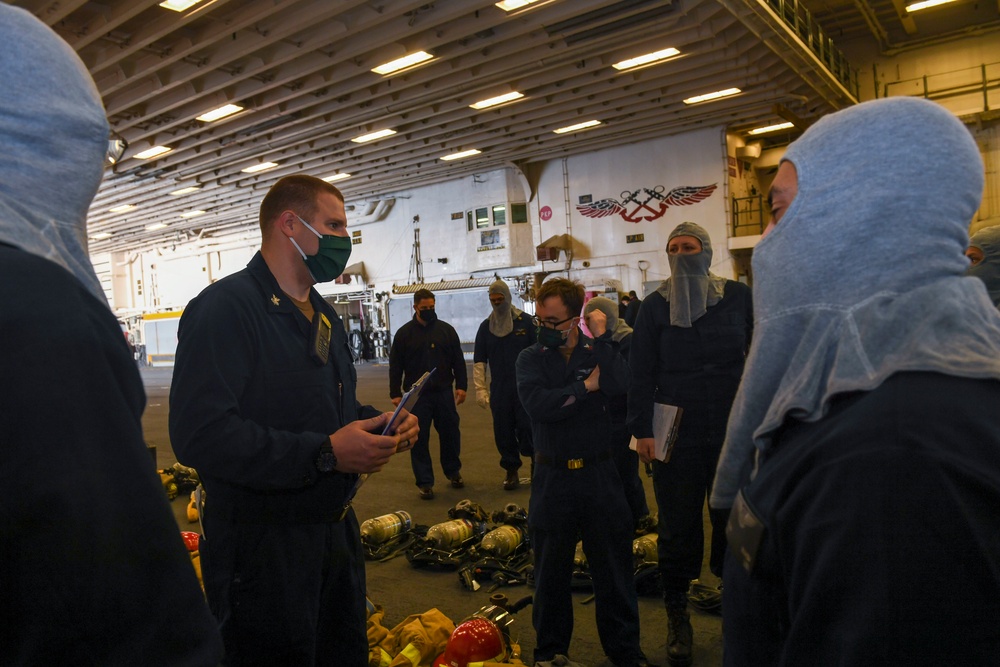 USS America (LHA 6)'s Sailor instructs group.