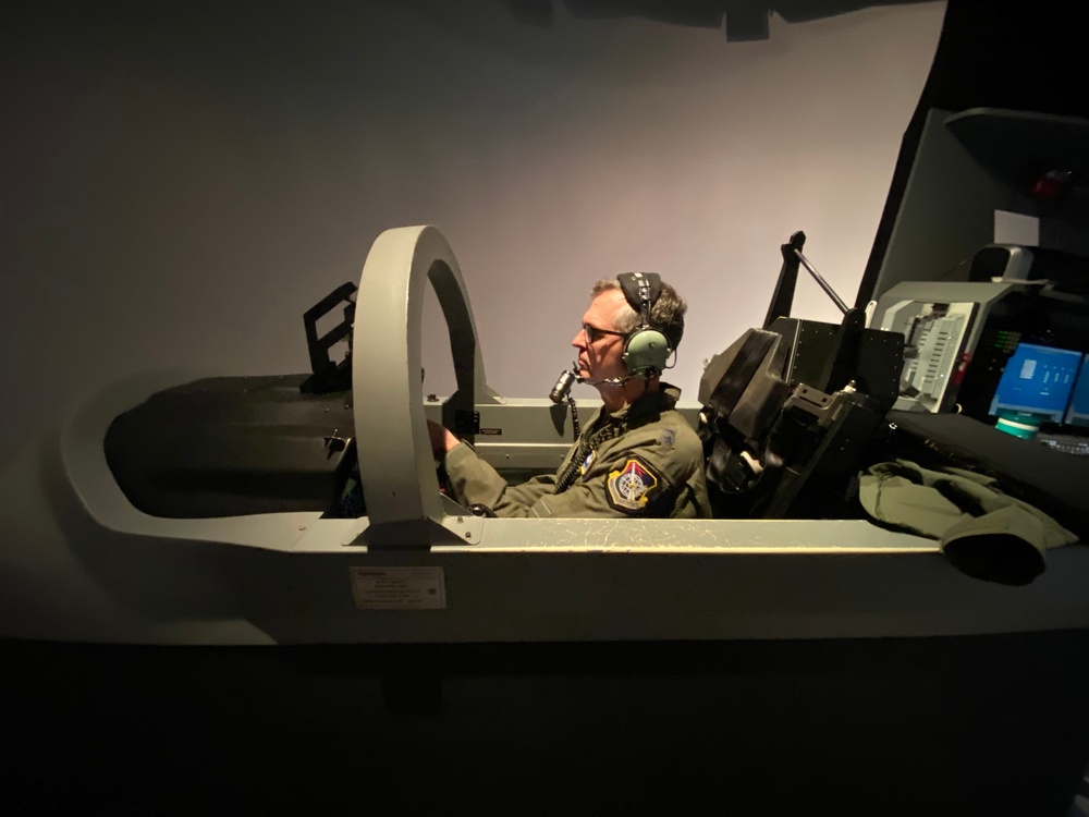 Air Force Maj. Gen. Craig D. Wills, Commander, 19th Air Force, experiences simulator